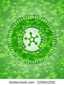 ninja star icon inside green mosaic emblem