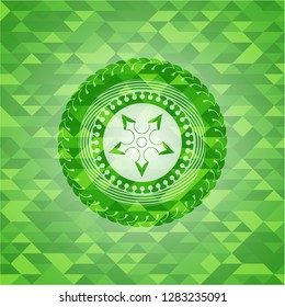 ninja star icon inside green emblem with triangle mosaic background