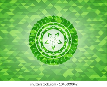 ninja star icon inside green emblem with mosaic background