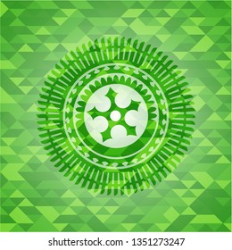 ninja star icon inside green emblem with mosaic background