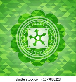 ninja star icon inside green emblem. Mosaic background