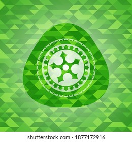 ninja star icon inside green mosaic emblem. 