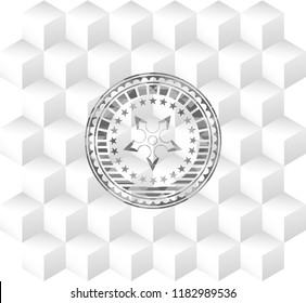 ninja star icon inside grey badge with geometric cube white background