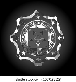 ninja star icon inside grey camouflage emblem
