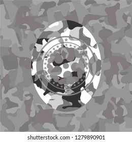 ninja star icon inside grey camouflage emblem