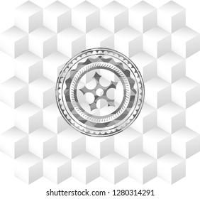 ninja star icon inside grey badge with geometric cube white background