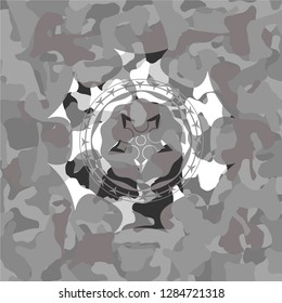 ninja star icon inside grey camo emblem