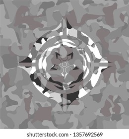 ninja star icon inside grey camo emblem
