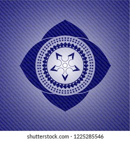 ninja star icon inside jean or denim emblem or badge background