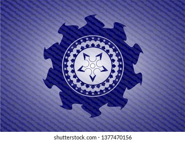 ninja star icon inside jean or denim emblem or badge background