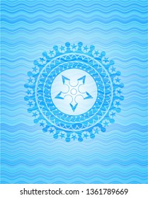 ninja star icon inside light blue water wave style emblem.