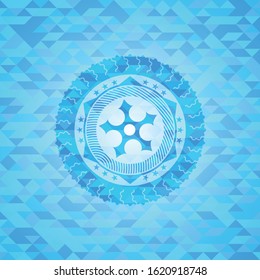 ninja star icon inside light blue mosaic emblem