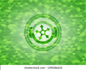 ninja star icon inside realistic green emblem. Mosaic background
