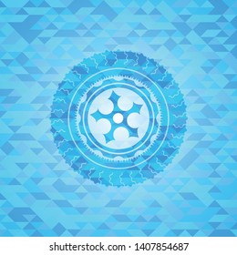 ninja star icon inside realistic light blue mosaic emblem