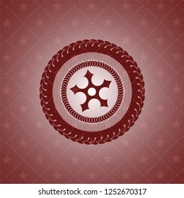 ninja star icon inside red emblem