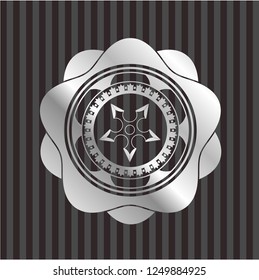ninja star icon inside silver badge or emblem