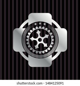 ninja star icon inside silver badge or emblem