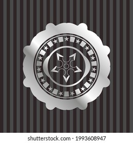 ninja star icon inside silver shiny emblem. 