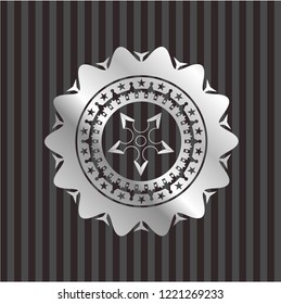 ninja star icon inside silvery emblem or badge