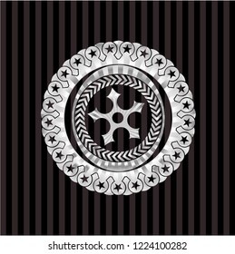 ninja star icon inside silvery badge