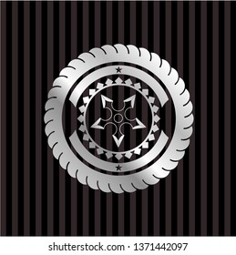 ninja star icon inside silvery emblem or badge