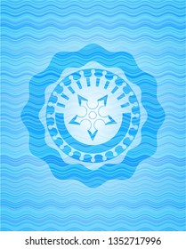 ninja star icon inside sky blue water badge.