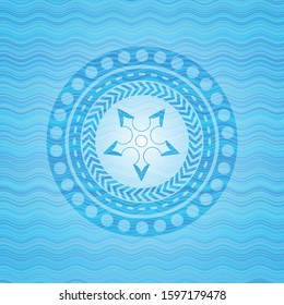 ninja star icon inside sky blue water wave badge background.