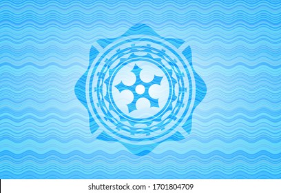 ninja star icon inside sky blue water wave badge background.