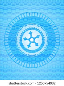 ninja star icon inside water concept badge.