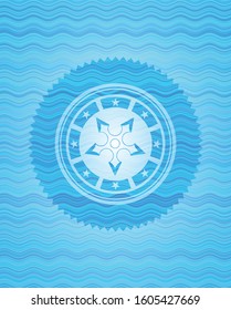 ninja star icon inside water wave concept style badge.