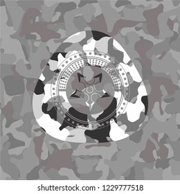 ninja star icon on grey camouflage pattern