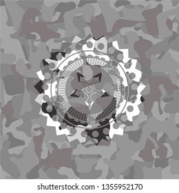 ninja star icon on grey camouflage pattern
