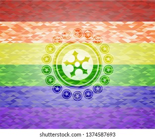 ninja star icon on mosaic background with the colors of the LGBT flag