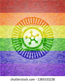 ninja star icon on mosaic background with the colors of the LGBT flag