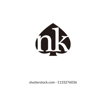 The nk initials logo inside the black shovel