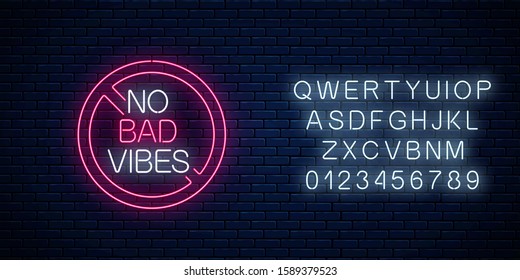 No bad vibes - glowing neon phrase in red warning circle with alphabet. Motivation quote in neon style. Vector illustration.