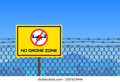 no drone zone sign hanging on barbed wire border restricted area