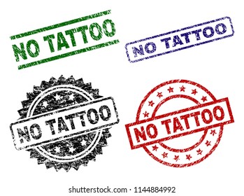 NO TATTOO seal prints with distress texture. Black, green,red,blue vector rubber prints of NO TATTOO label with dust texture. Rubber seals with circle, rectangle, medallion shapes.