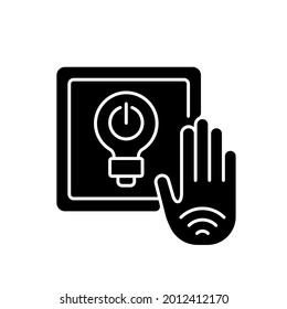 No touch light switch black glyph icon. Touchless switches incorporate sensor that detects hand trough decorative switch plate. Silhouette symbol on white space. Vector isolated illustration