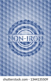 Non-iron blue emblem with geometric background.