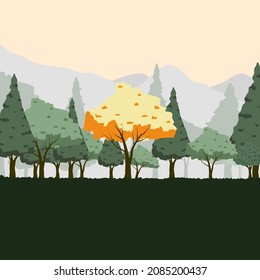 Nonseasonal tree located in the forest with mountain background.