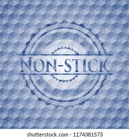 Non-stick blue badge with geometric pattern.