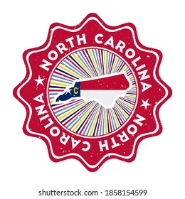 North Carolina round grunge stamp with US state map and state flag. Vintage badge with circular text and stars, vector illustration.