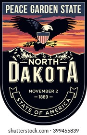 North Dakota state emblem, sunset on a dark background