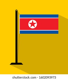 north korea flag on pole, isolated on yellow background