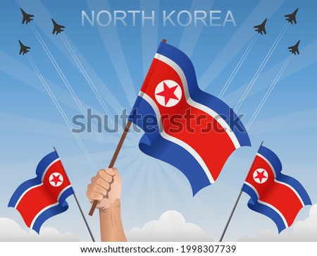 North Korea flags fluttering under the blue sky