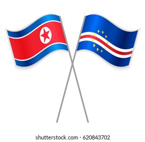 North Korean and Cabo Verdean crossed flags. North Korea combined with Cabo Verde isolated on white. Language learning, international business or travel concept.