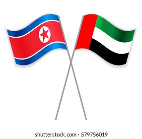 North Korean and Emirian crossed flags. North Korea combined with United Arab Emirates isolated on white. Language learning, international business or travel concept.