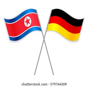 North Korean and German crossed flags. North Korea combined with Germany isolated on white. Language learning, international business or travel concept.