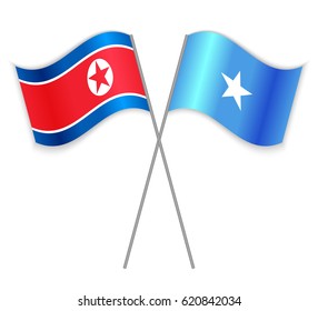 North Korean and Somali crossed flags. North Korea combined with Somalia isolated on white. Language learning, international business or travel concept.